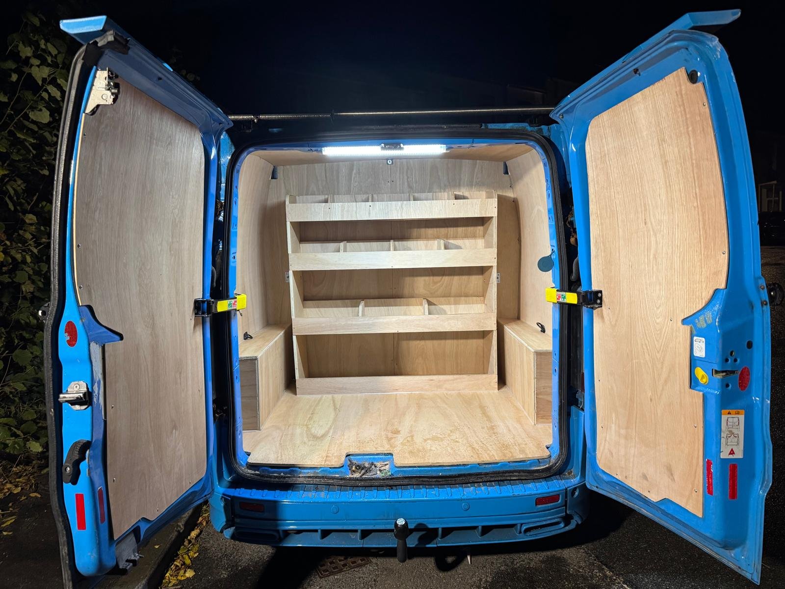 Professionally fitted plywood lining and storage installation